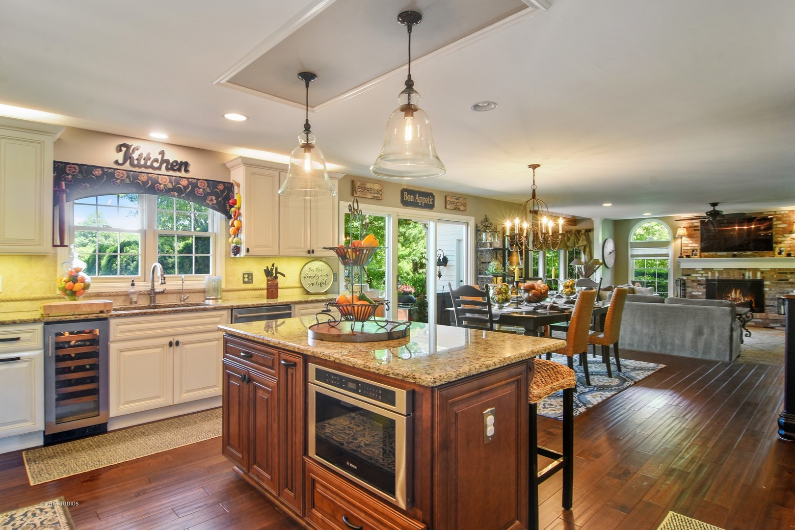 20755 North Weatherstone Road Kildeer, IL 60047 - Photo 7 of 61 a kitchen with a stove a counter space dining table and chairs
