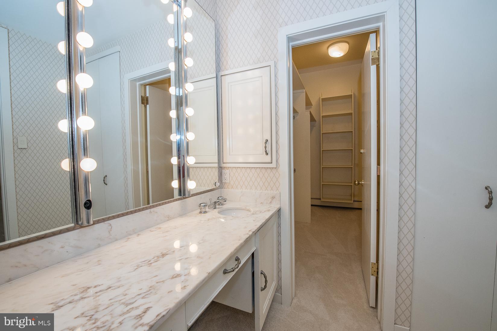 39 Fairview Road Penn Valley, PA 19072 - Photo 12 of 20 a bathroom with a sink a mirror and a shower