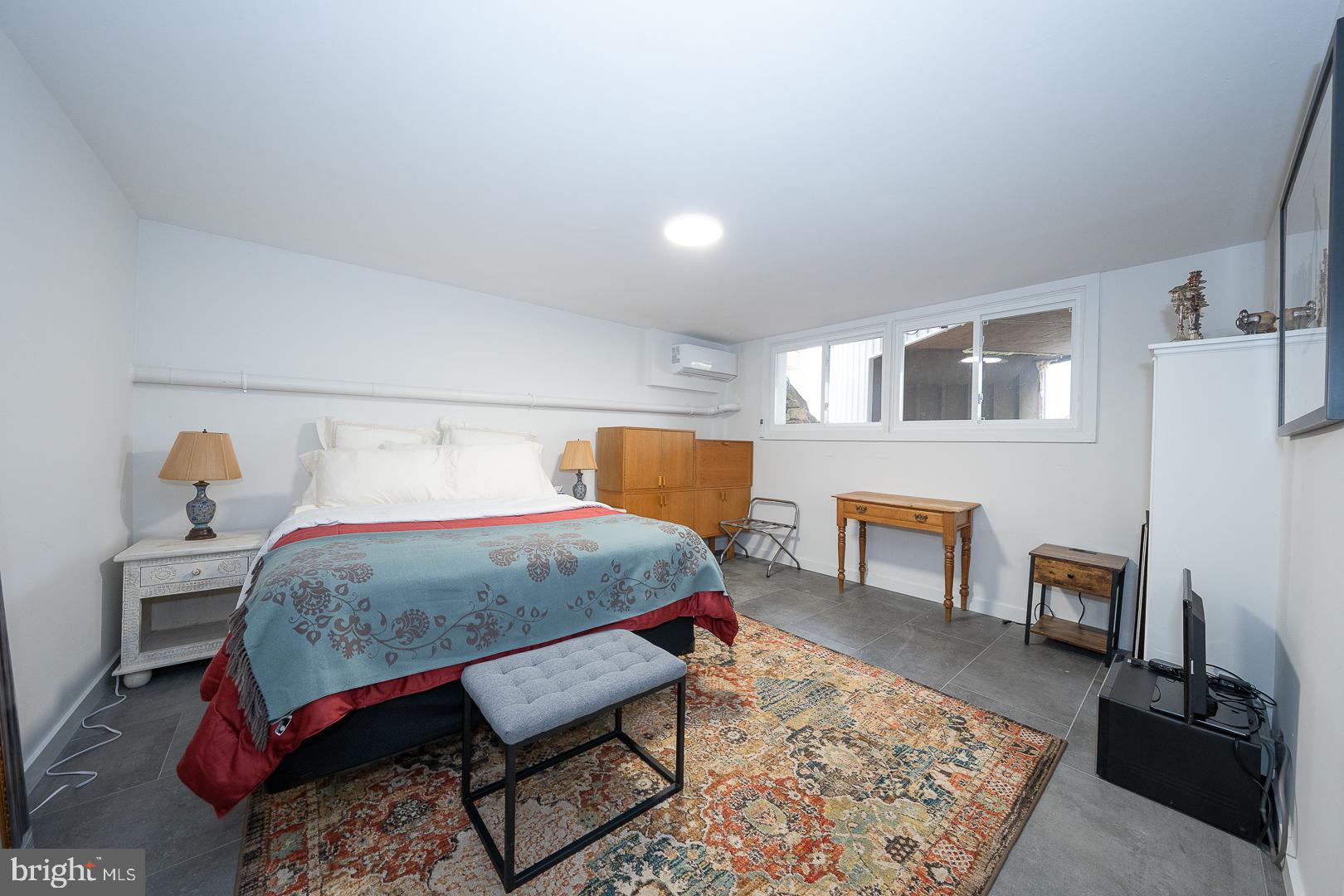 39 Fairview Road Penn Valley, PA 19072 - Photo 18 of 20 a bedroom with a bed a table and chair