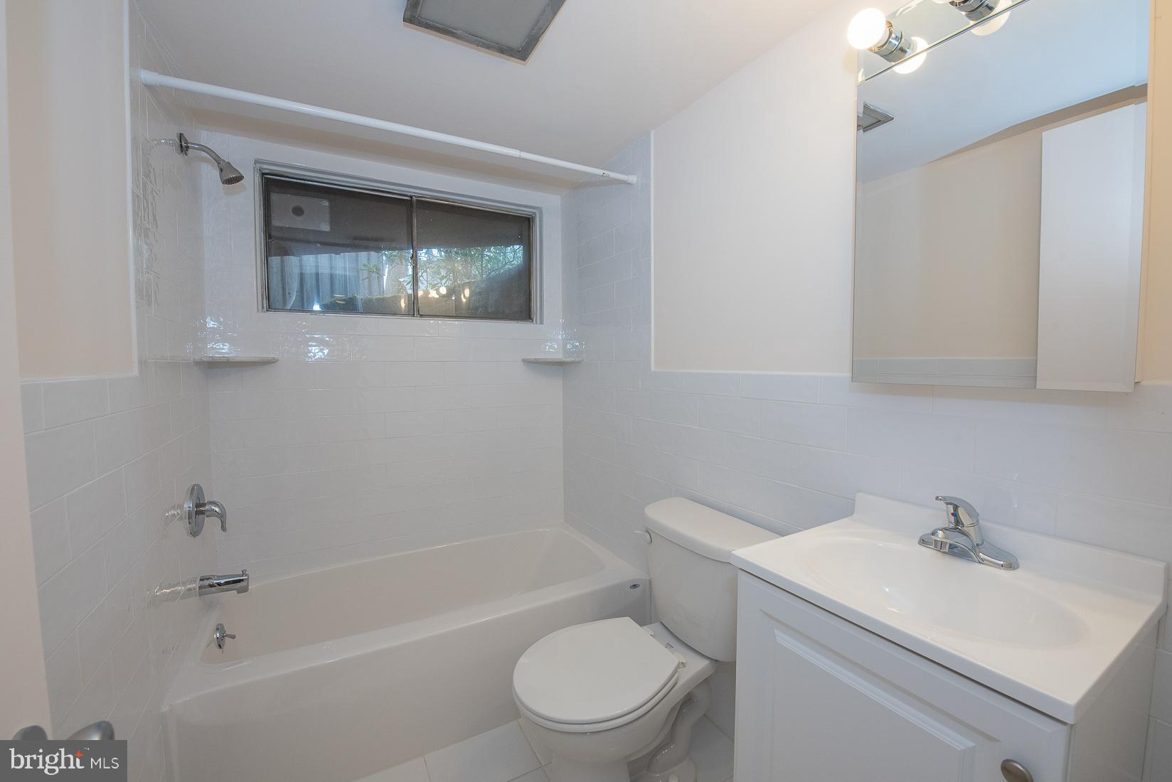 39 Fairview Road Penn Valley, PA 19072 - Photo 19 of 20 a bathroom with a sink toilet and tub