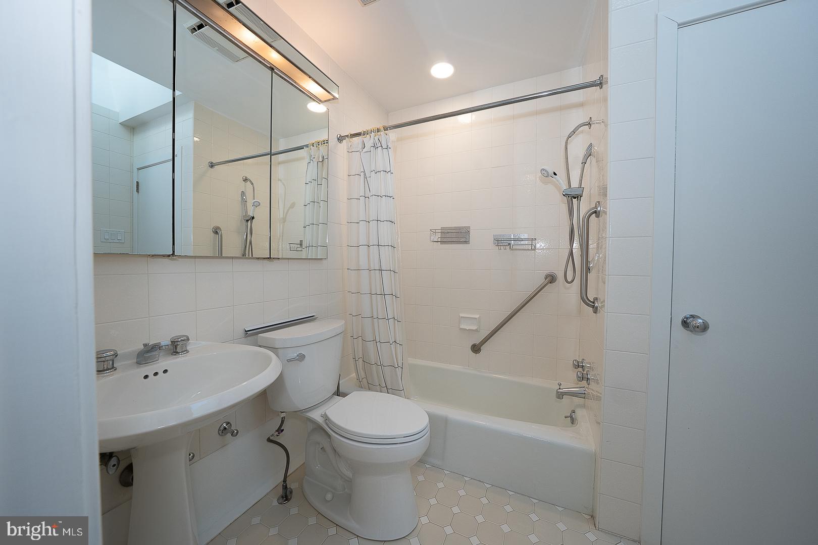 39 Fairview Road Penn Valley, PA 19072 - Photo 21 of 34 a bathroom with a shower sink vanity mirror and toilet