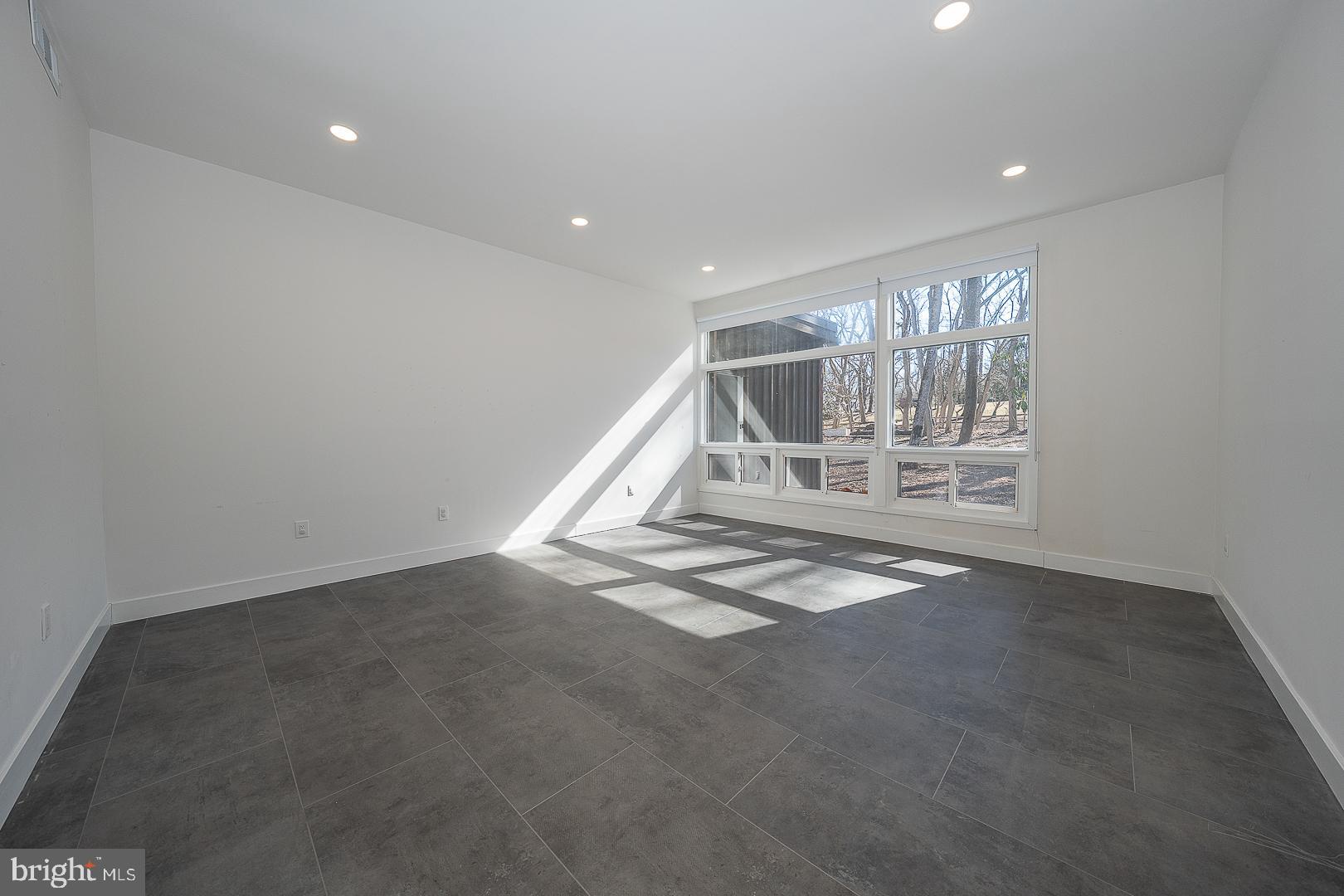 39 Fairview Road Penn Valley, PA 19072 - Photo 24 of 34 a view of wooden floor and windows in a room