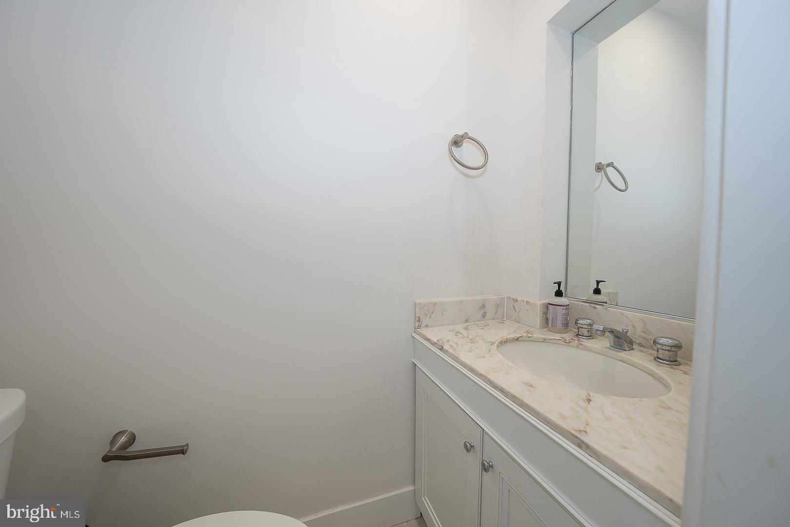 39 Fairview Road Penn Valley, PA 19072 - Photo 28 of 34 a bathroom with a granite countertop sink and vanity