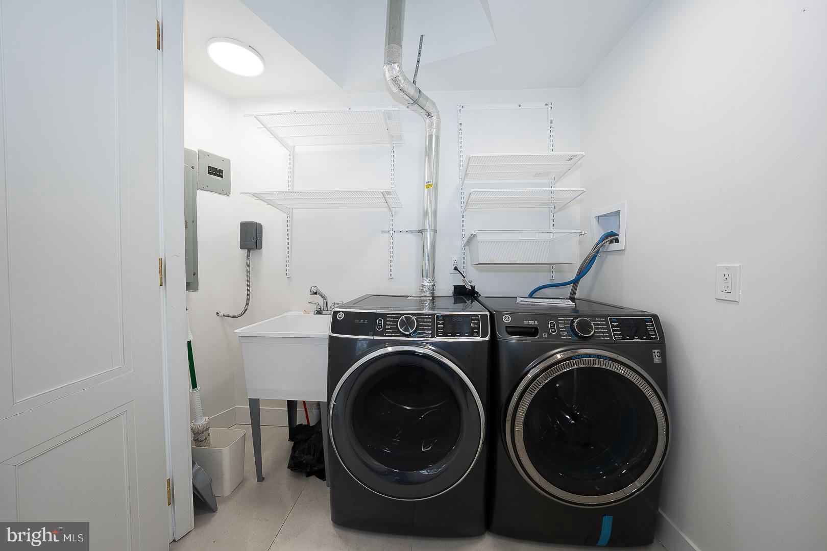 39 Fairview Road Penn Valley, PA 19072 - Photo 29 of 34 a utility room with dryer and washer