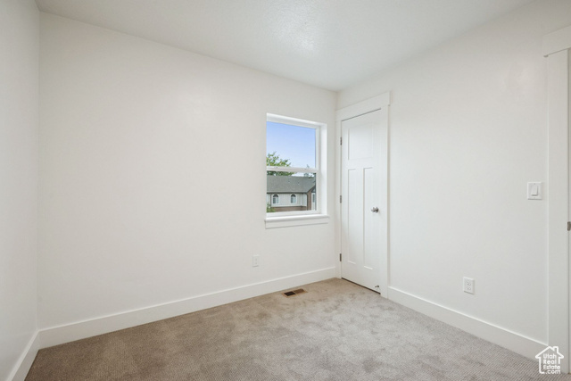 1615 North Angel Street, Unit E Layton, UT 84041 - Photo 28 of 42 Unfurnished room featuring carpet floors and baseboards
