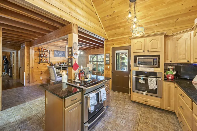 a dining room with furniture and a chandelier