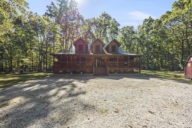 a view of a balcony with a floor to ceiling window and wooden fence