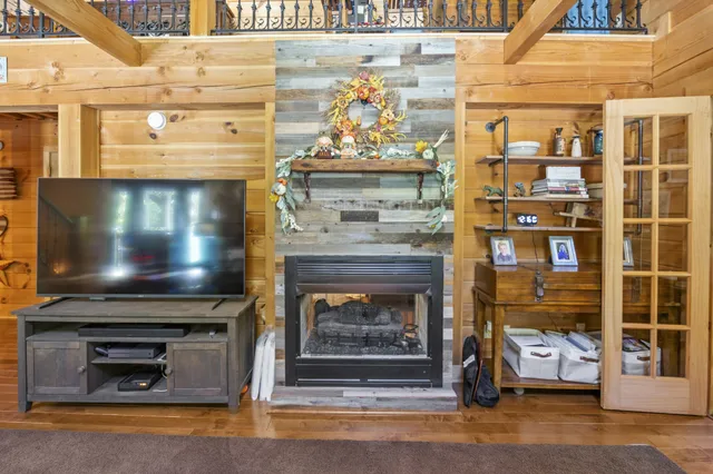 a bedroom with furniture and a window
