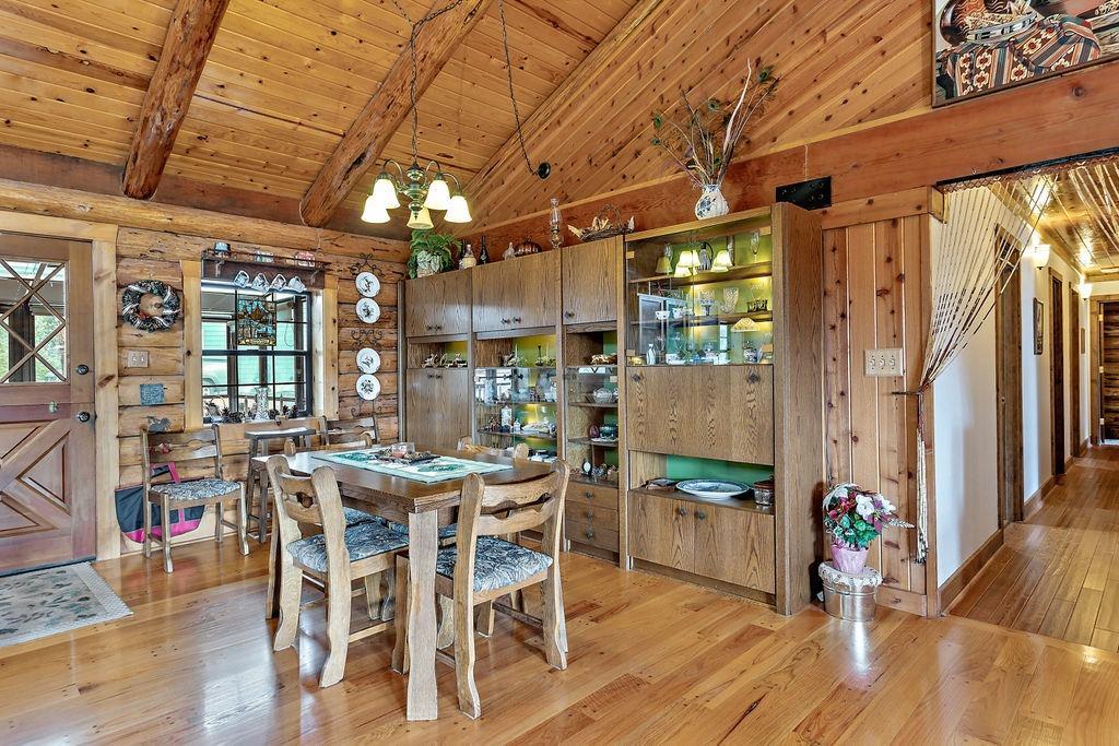 9196 Upper Applegate Road Jacksonville, OR 97530 - Photo 15 of 35 a view of a dining room with furniture window and wooden floor