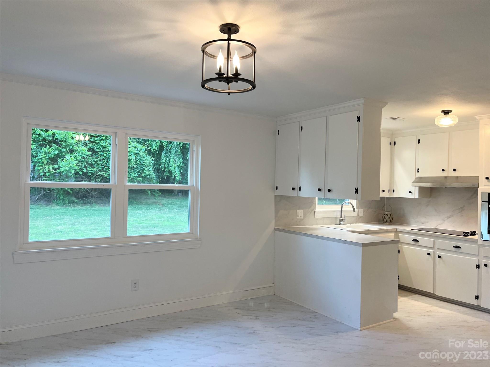 35 Circle Loop Stony Point, NC 28678 - Photo 15 of 46 a kitchen with a sink cabinets and window