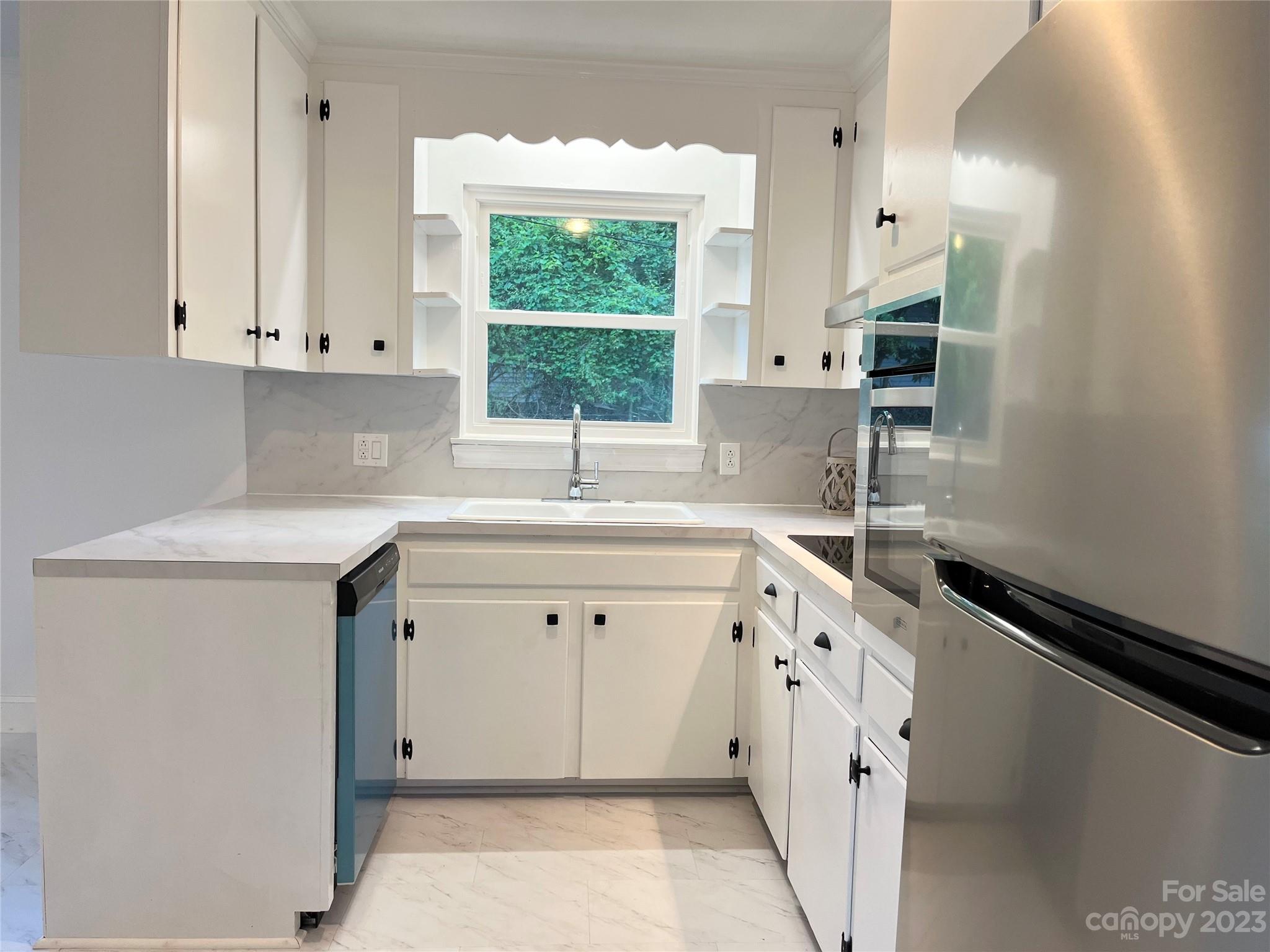 35 Circle Loop Stony Point, NC 28678 - Photo 22 of 46 a kitchen with a sink cabinets and window