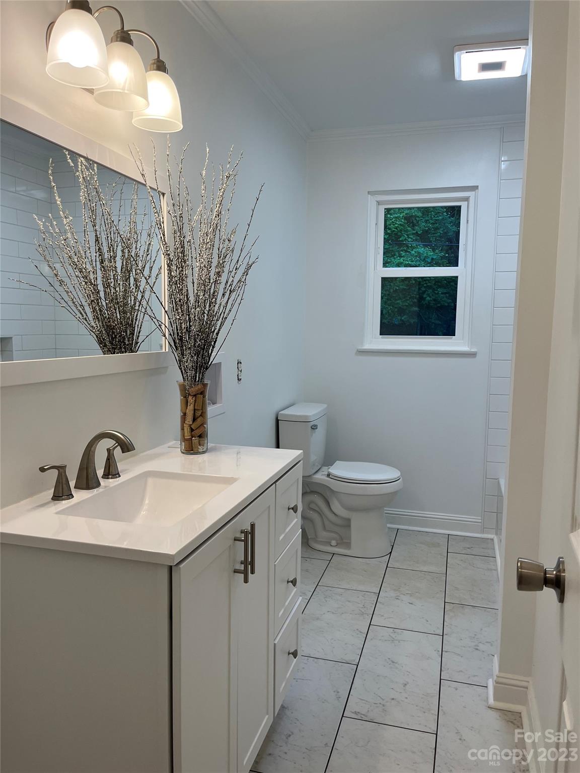 35 Circle Loop Stony Point, NC 28678 - Photo 24 of 46 a bathroom with a toilet a sink and mirror