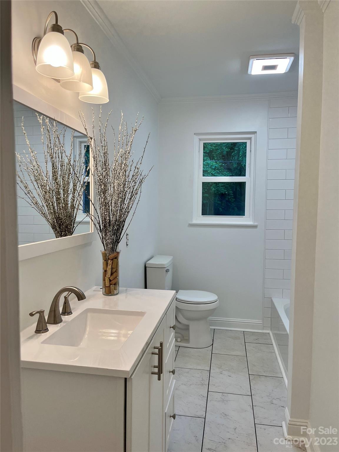 35 Circle Loop Stony Point, NC 28678 - Photo 26 of 46 a bathroom with a toilet sink and mirror