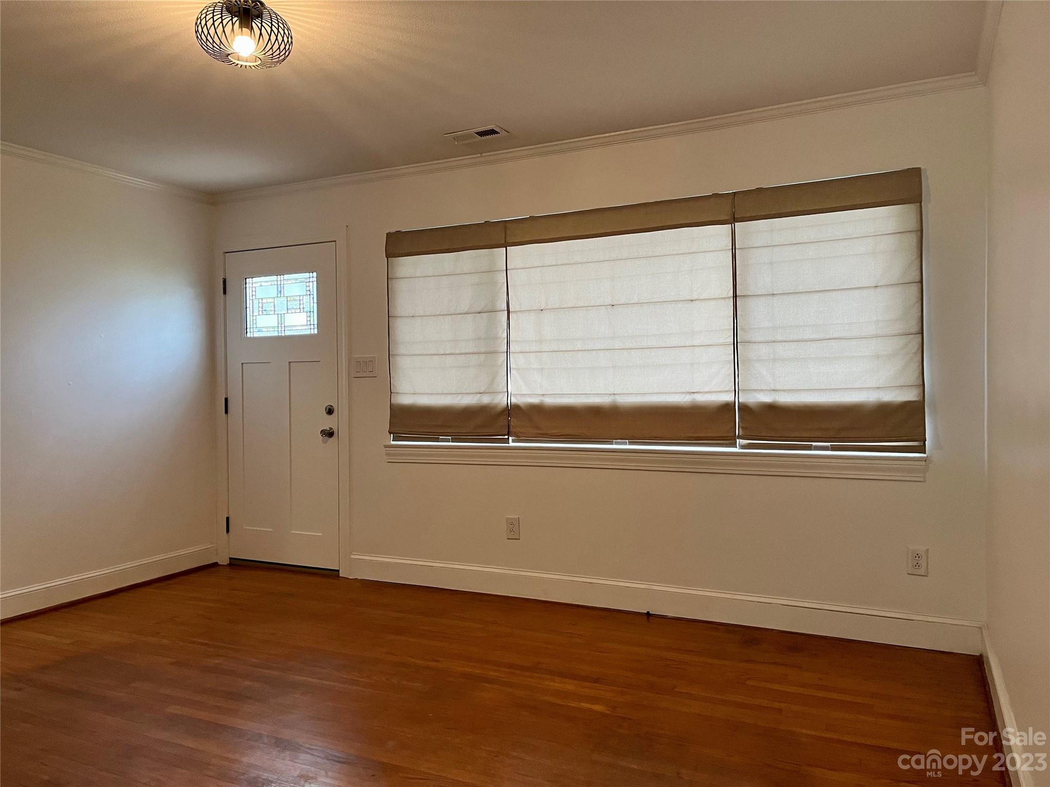 35 Circle Loop Stony Point, NC 28678 - Photo 32 of 46 a view of an empty room with wooden floor and a window