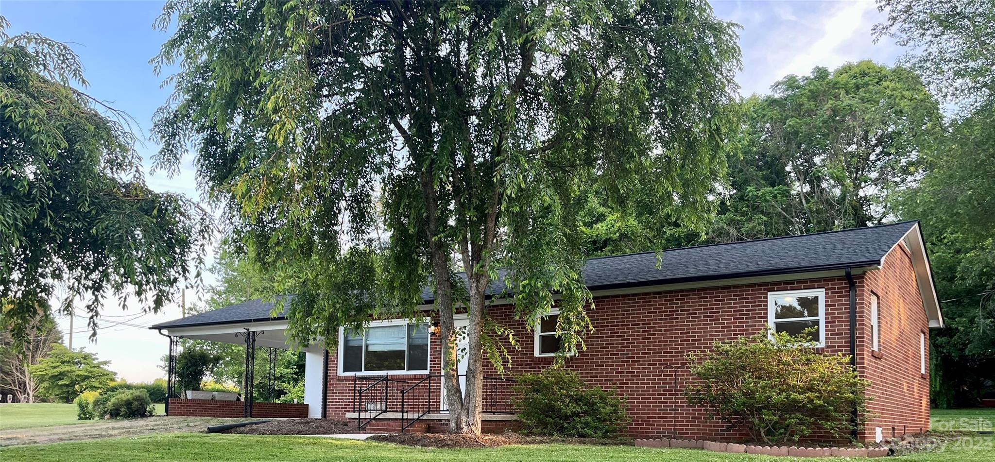 35 Circle Loop Stony Point, NC 28678 - Photo 4 of 46 a front view of a house with a garden