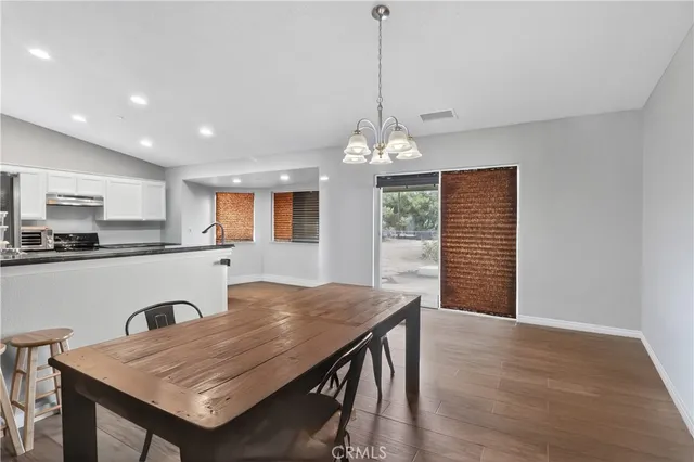 a open kitchen with dining table and chairs
