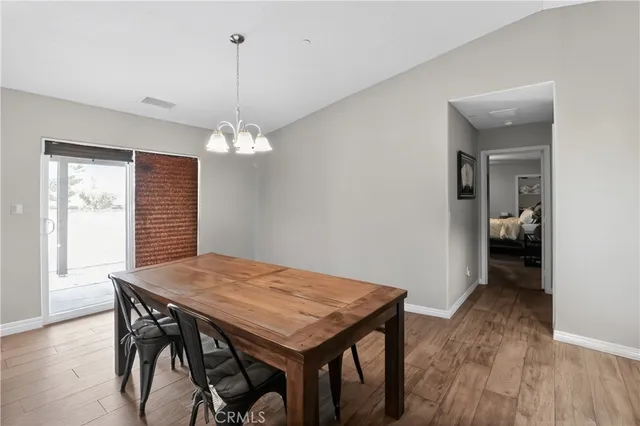 a view of a dining table and chairs in a room