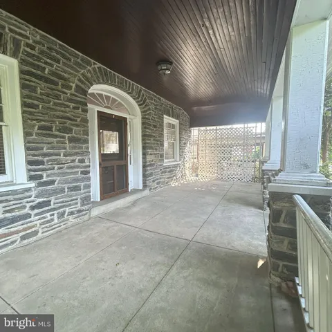 a view of an empty room with a fireplace