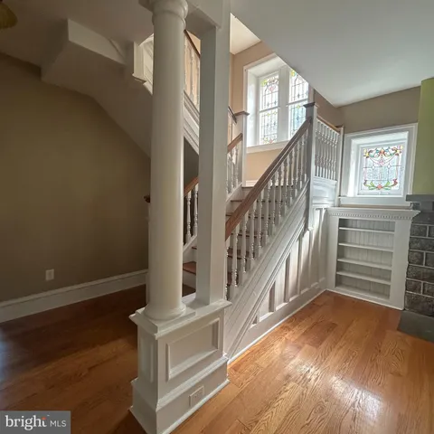 a view of an entryway with wooden floor