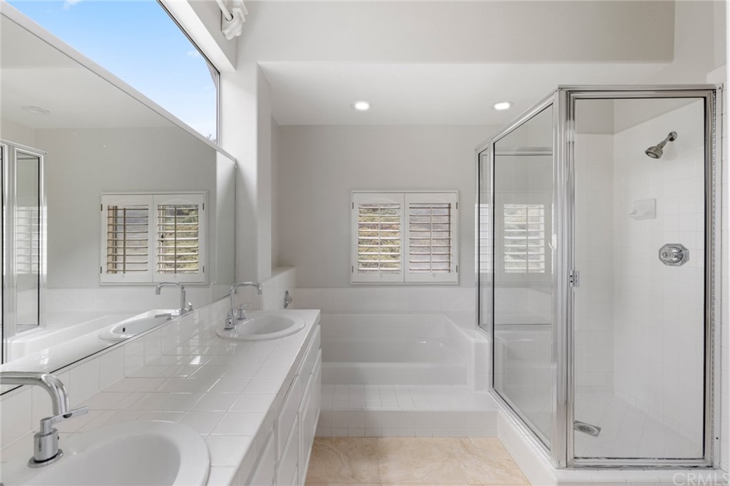 33696 Bridgehampton Drive Dana Point, CA 92629 - Photo 15 of 20 a bathroom with a tub sink and mirror
