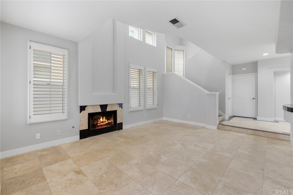 33696 Bridgehampton Drive Dana Point, CA 92629 - Photo 3 of 20 a view of an empty room with a fireplace and a window