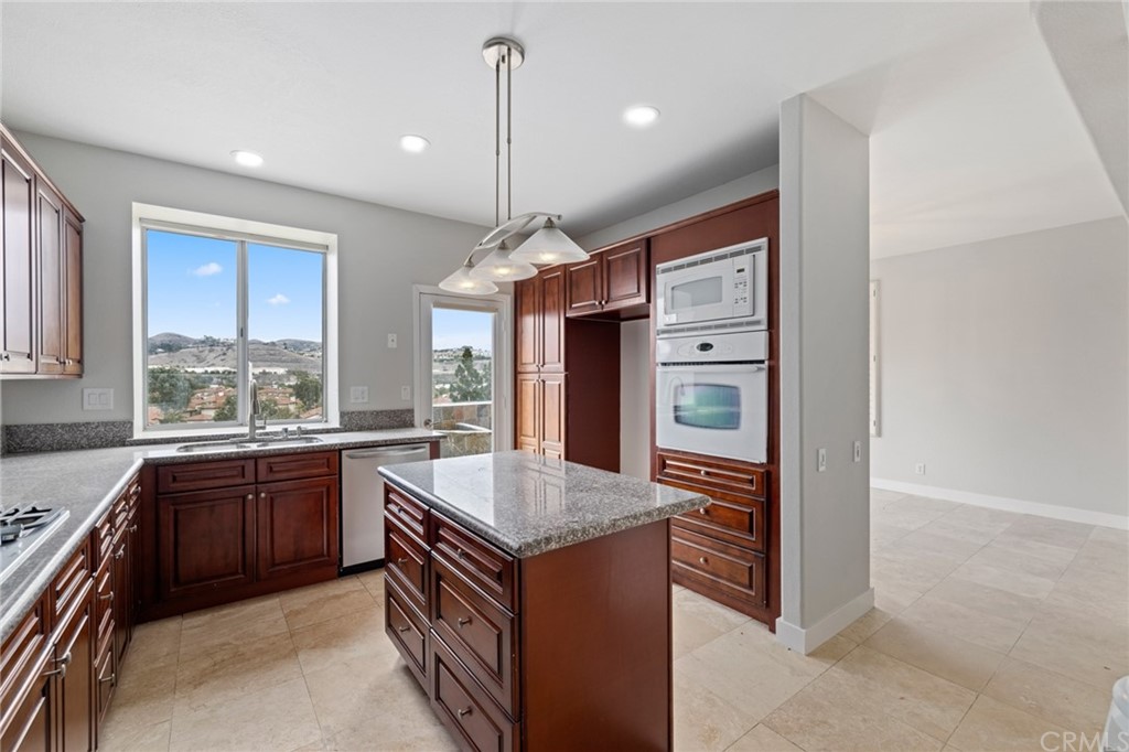 33696 Bridgehampton Drive Dana Point, CA 92629 - Photo 7 of 20 a kitchen with stainless steel appliances granite countertop a stove and a sink