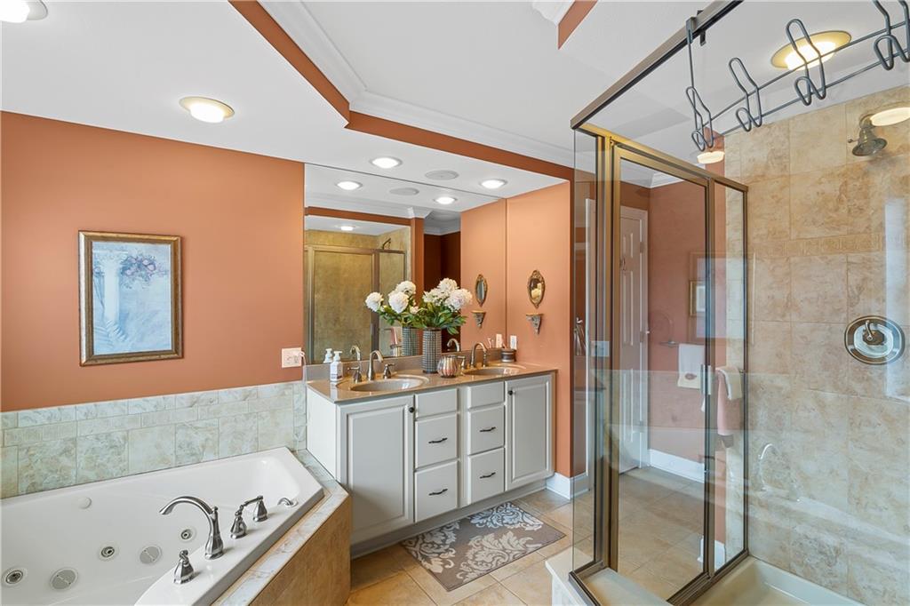 222 Arch Street, Unit E Verona, PA 15147 - Photo 13 of 24 a bathroom with a tub sink and mirror