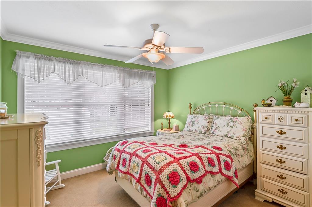 222 Arch Street, Unit E Verona, PA 15147 - Photo 14 of 24 a bedroom with a bed and a window