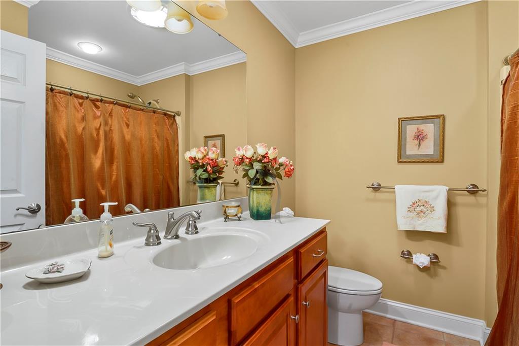 222 Arch Street, Unit E Verona, PA 15147 - Photo 15 of 24 a bathroom with a granite countertop sink mirror vanity and toilet