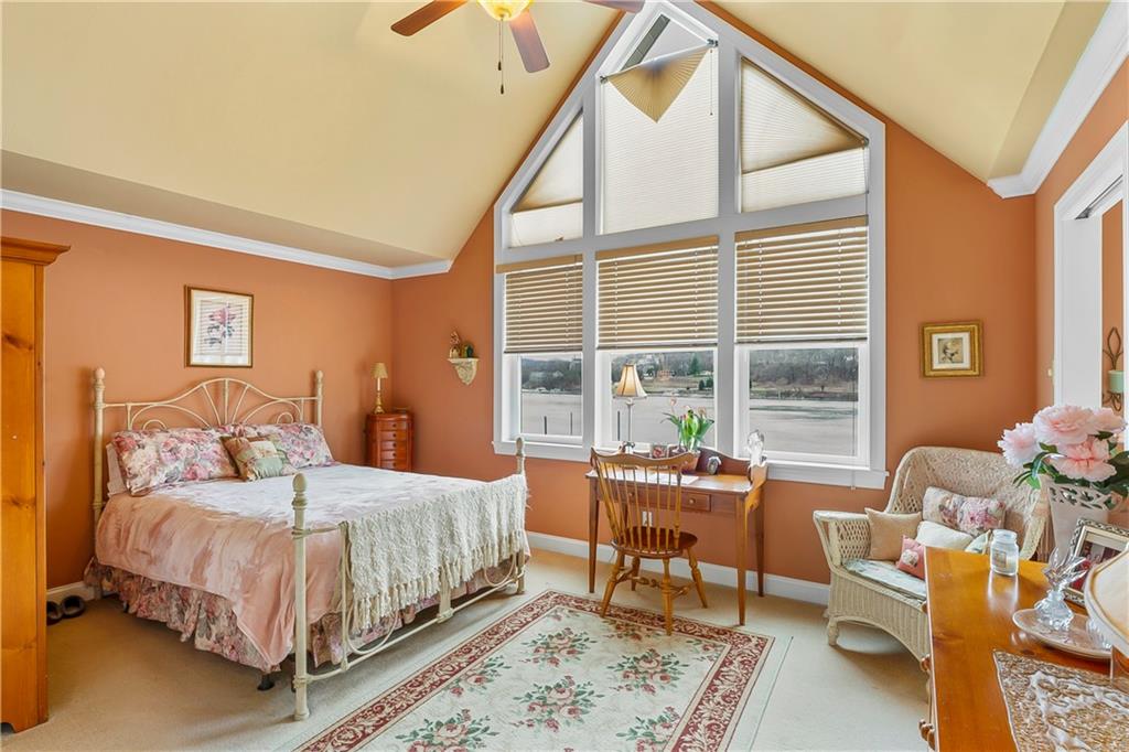 222 Arch Street, Unit E Verona, PA 15147 - Photo 10 of 24 a bedroom with a bed and wooden floor