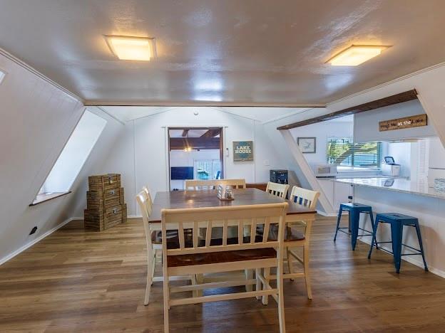 3817 Blue Fin Road Caddo, TX 76429 - Photo 17 of 40 a view of a dining room with furniture and wooden floor
