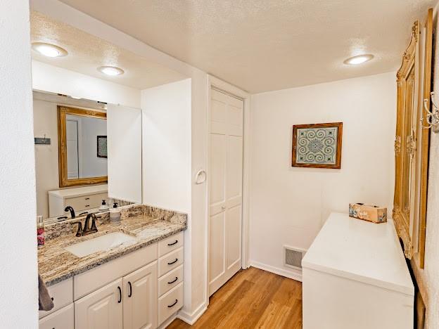 3817 Blue Fin Road Caddo, TX 76429 - Photo 27 of 40 a bathroom with a granite countertop sink and a mirror