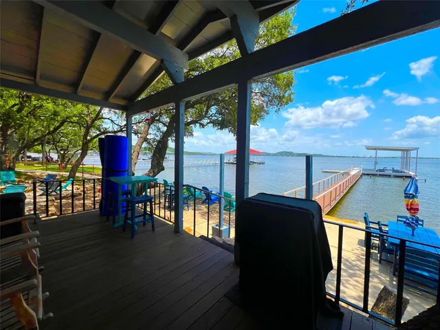 swimming pool view with a seating space and a garden view