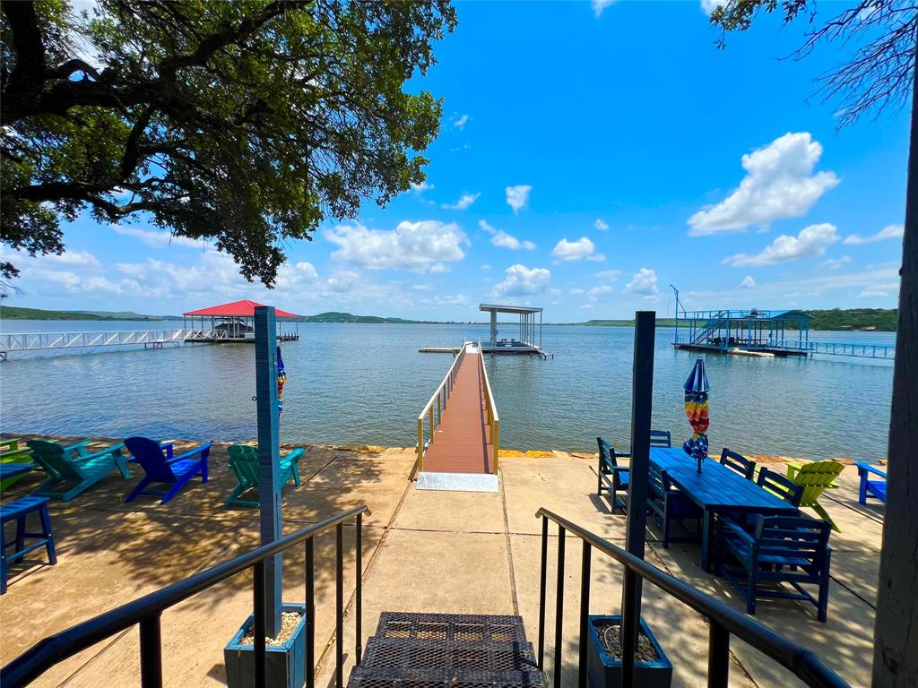 3817 Blue Fin Road Caddo, TX 76429 - Photo 34 of 40 a view of a balcony with lake view and a potted plant