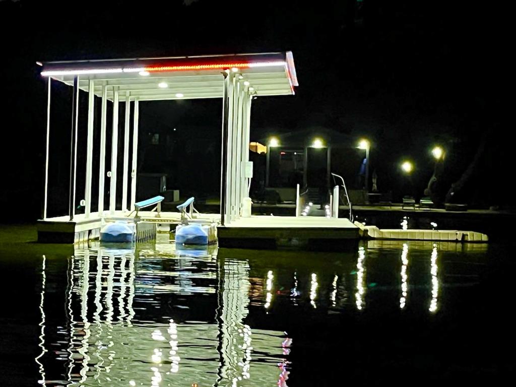 3817 Blue Fin Road Caddo, TX 76429 - Photo 37 of 40 a bathroom with a sink and a large mirror