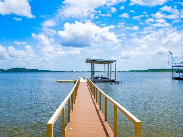 a view of swimming pool with a lake