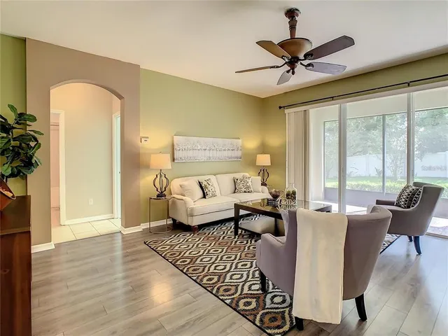 a living room with furniture and a large window