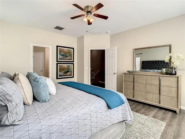 a bedroom with a bed and a dresser