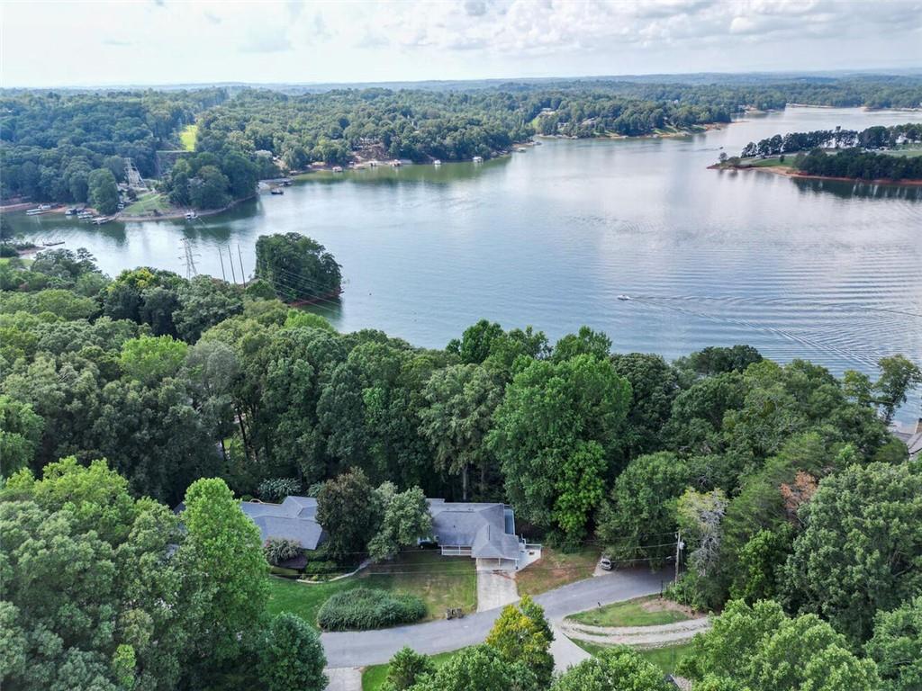 an aerial view of a house with a lake view