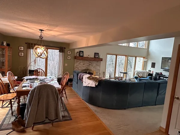 a living room with furniture a window and a fireplace
