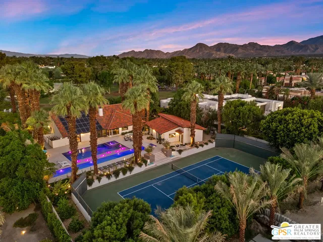 a kitchen with sink a stove and cabinets