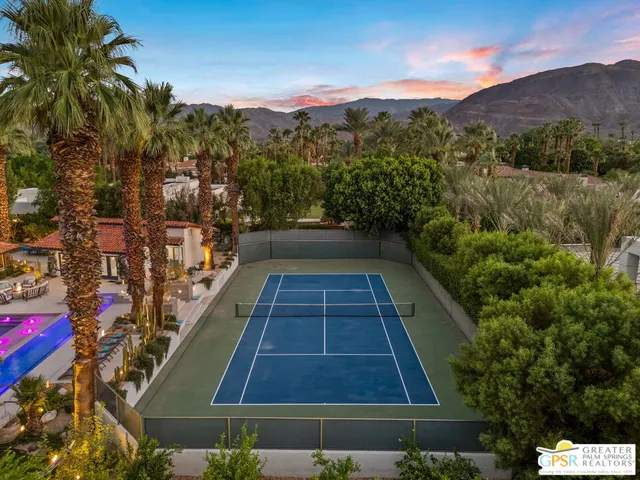 a kitchen with stainless steel appliances a sink and a large window