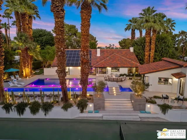 a view of house with outdoor space and swimming pool