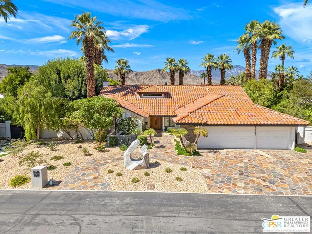 a open kitchen with stainless steel appliances granite countertop a stove and a refrigerator
