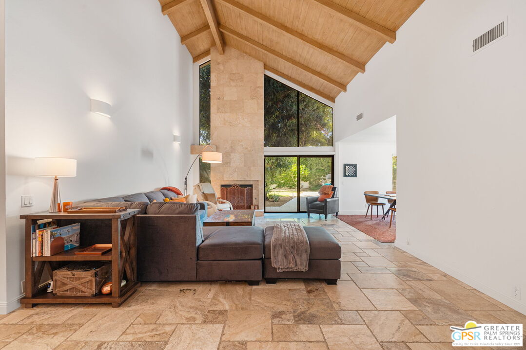 40563 Desert Creek Lane Rancho Mirage, CA 92270 - Photo 26 of 75 a living room with furniture a flat screen tv and a window