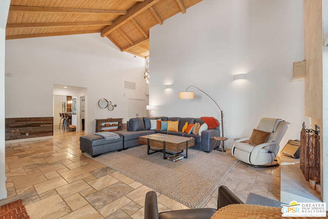 40563 Desert Creek Lane Rancho Mirage, CA 92270 - Photo 28 of 75 a living room with furniture and a couch