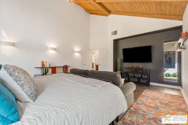a en suite bathroom with a shower sink and mirror