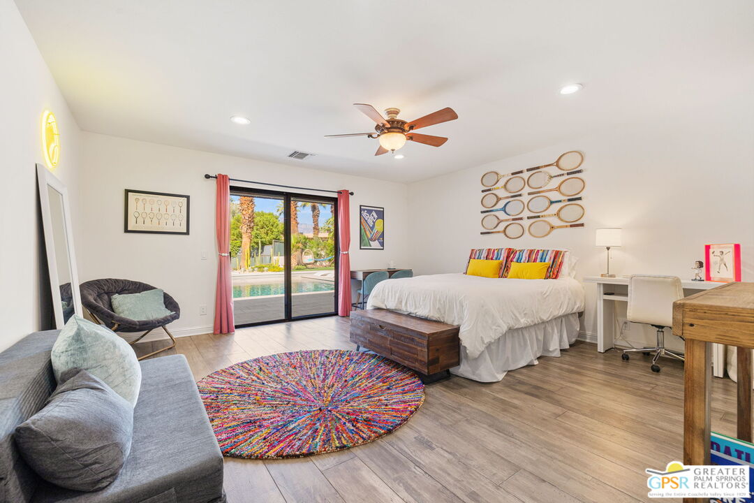 40563 Desert Creek Lane Rancho Mirage, CA 92270 - Photo 49 of 75 a bedroom with a bed and wooden floor