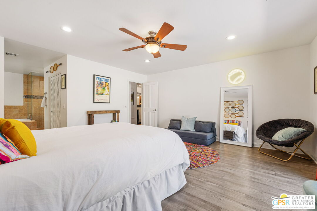 40563 Desert Creek Lane Rancho Mirage, CA 92270 - Photo 50 of 75 a bedroom with a bed and wooden floor