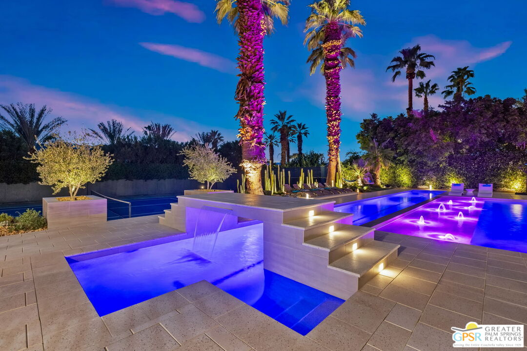 40563 Desert Creek Lane Rancho Mirage, CA 92270 - Photo 6 of 75 a view of swimming pool with red chairs
